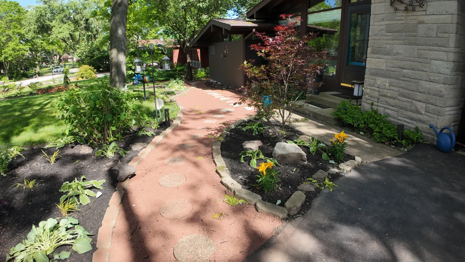 Aerial view of landscape design with red mulch path and Japanese maple tree