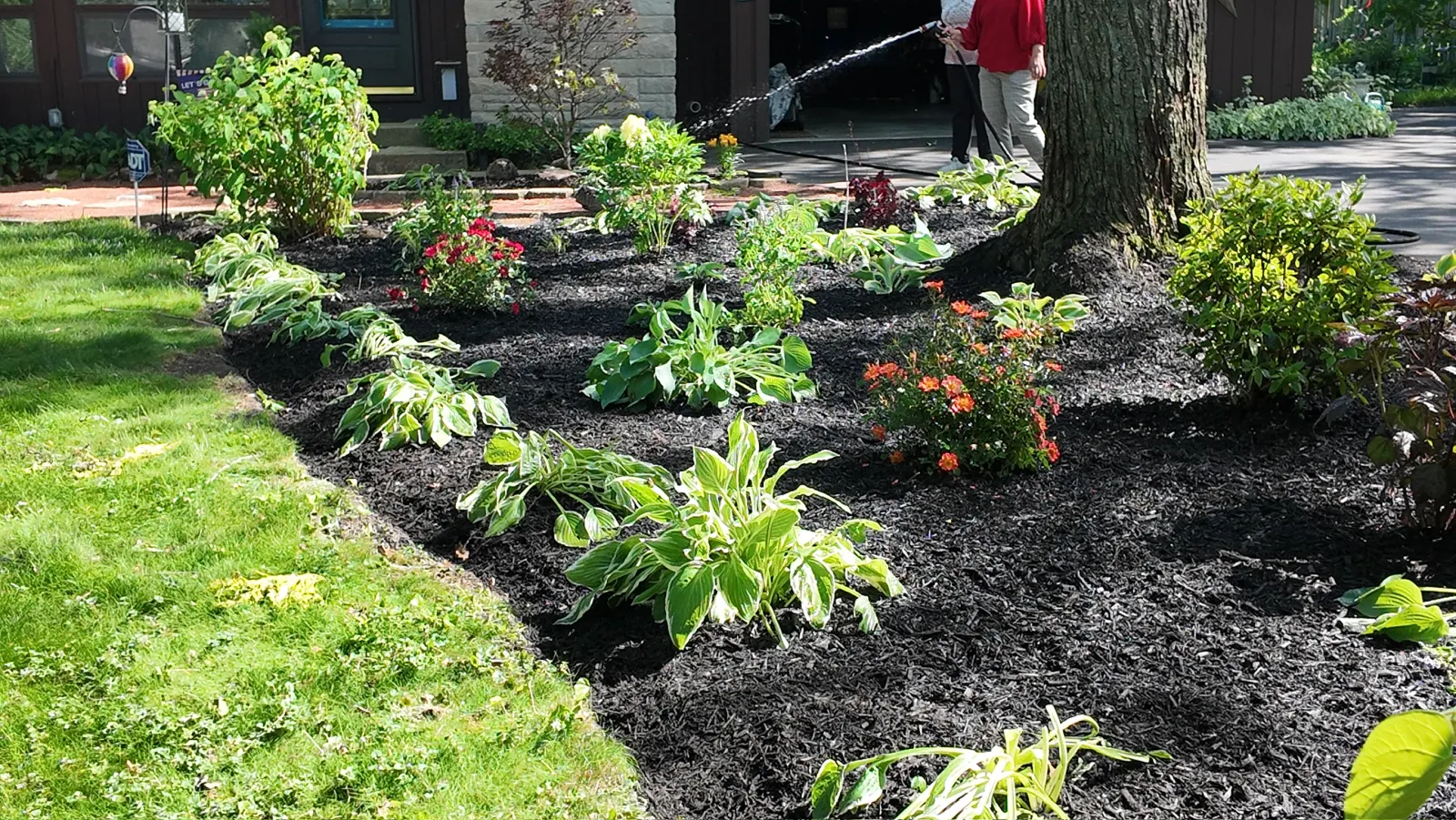 Smith Brothers crew watering newly installed landscape plantings