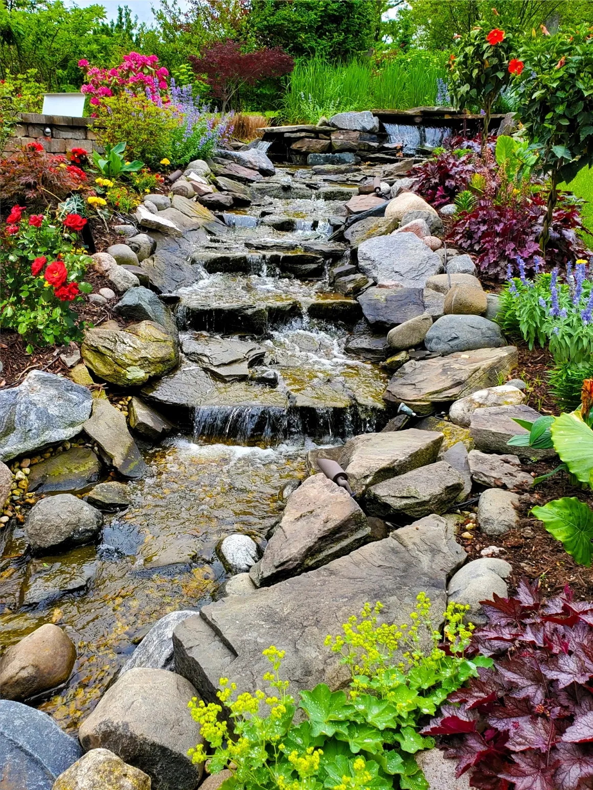 Natural stone waterfall garden feature