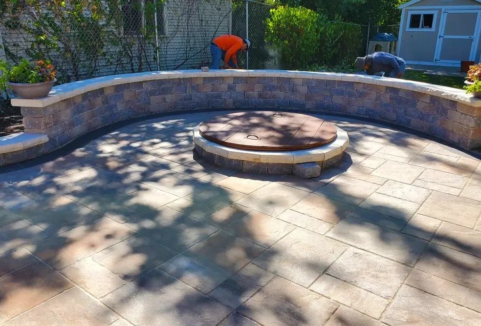 Paver patio with firepit and seating wall